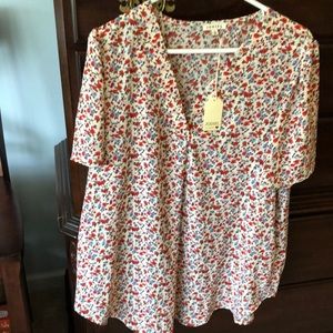 Flowered short sleeve blouse.